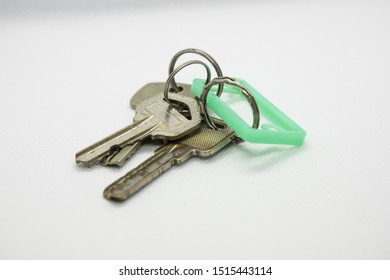 Old House Keys Hook With A Green Plastic Chain.