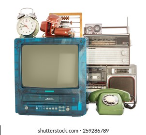 Old household items: TV, VCR, radio, camera, alarm, phone, recorder, abacus.   Old household items isolated on white background. 