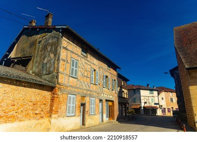 Old Houses Along Paved Streets Of Saint-Trivier-de-Courtes, Eastern France. Bressan Village Street Under Deep Blue Sky.