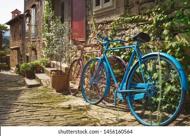 The Old Houses, Ancient Pavement And Colorful Bike On The Street Of Medieval Town Hum In Istria, Croatia