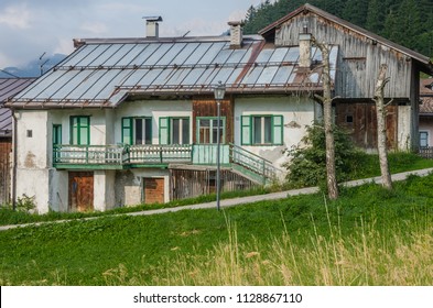 Old houses in Fontanazzo di Fassa village, Dolomites, Trentino-Alto-Adige, Italy - Shutterstock ID 1128867110