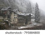 The old huts in the snowfall