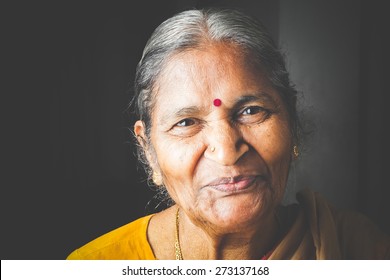 An Old Indian Beautiful Traditional Woman Smiling At He Camera