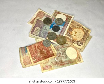 Old Indian Currency. Old Coins And Notes Isolated On The White Background.