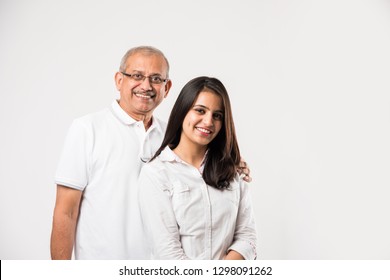 old Indian father with young girl standing isolated over white background
