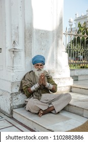 old indian sikh praying nearby golden temple. 26 february 2018 Amritsar, India.