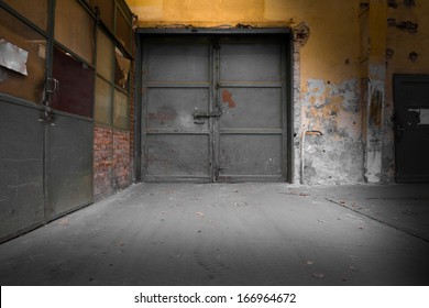 old industrial iron door, a machine factory - Powered by Shutterstock