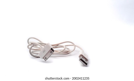 Old Iphone USB Cable Isolated In White Background Was Taken On 5 July 2021 In Bandung Indonesia.