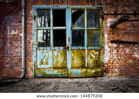 Old iron door glass brick wall
