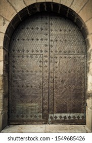 Old Iron Door In A Medieval Building
