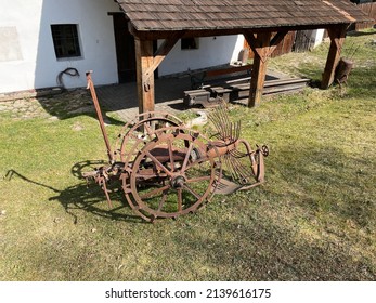 Old iron farmer machine for excavation of potatoes. Farming equipment coming from the middle of 20th century used like in exposition in historical museum in Nove Hrady close to the castle in Czechia. - Powered by Shutterstock