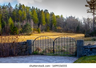 Old Iron Gate Leading From Church Yard Out To A Field.
Shot In Sweden, Europe.