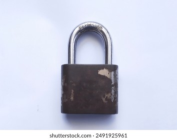 Old iron padlock with rust on the surface. Iron padlock isolated on white background. - Powered by Shutterstock