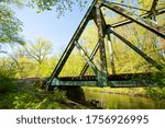 Old iron railroad bridge over the Willimantic River, still in use, in the Kollar Wildlife Management Area of Tolland, Connecticut.