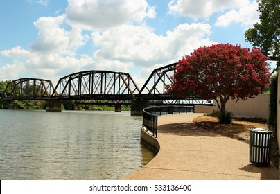 An old iron railroad bridge over the Brazos river near downtown Waco