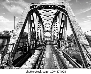 Old iron railway bridge in black and white