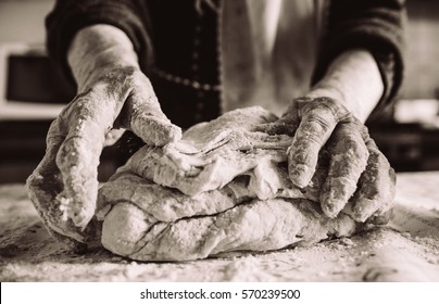 Old Italian Woman Making Pasta In The Kitchen Sepia Effect