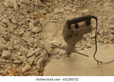 Old Jack Hammer That Demolishing Concrete Floor Was Stuck During Break In Construction Site.