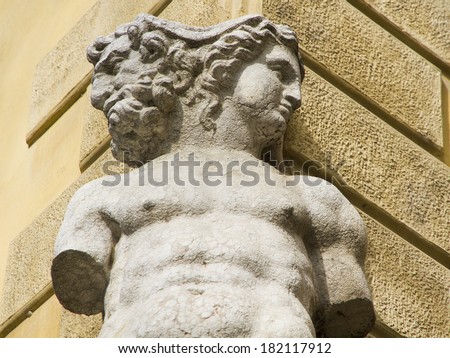 Old Janus sculpture in Reggio Emilia, Italy