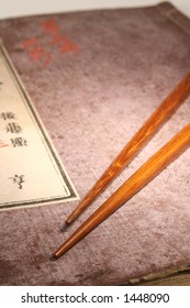 Old Japanese Book From Meiji Period With Chopsticks And Japanese Maple Leaf