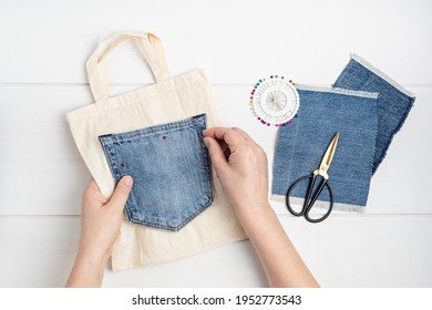 Old jeans reusing idea. Crafting with denim, recycling old clothers, hobby, diy activity. Sustainable, zero waste lifestyle concept - Shutterstock ID 1952773543