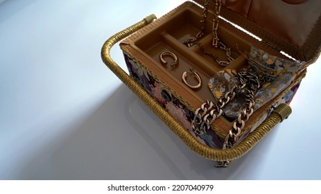 An Old Jewelry Box With Different Jewelry