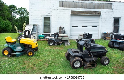 Old Junk Riding Lawnmowers For Sale In Front Of Small Family Business In Rural Country USA, Lawn Care, Cutting Grass, Mower, Quirky, Roadside Attractions, Travel Oddities, Funny, Lawn Art