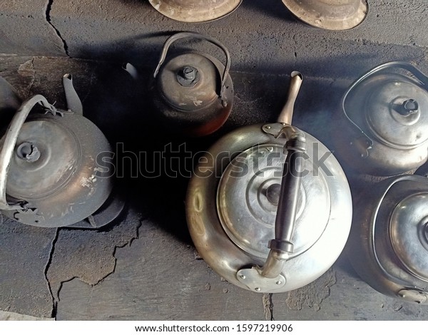 Old kettle in the\
fireplace