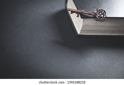 Old key with bible. Concept of wisdom and knowledge - Shutterstock ID 1396188218