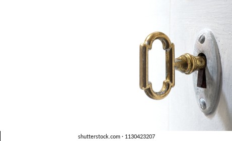 Old key in keyhole, macro shot, white background. Retro style. Concept and Idea for History, business, security background. Write Your Text Here.