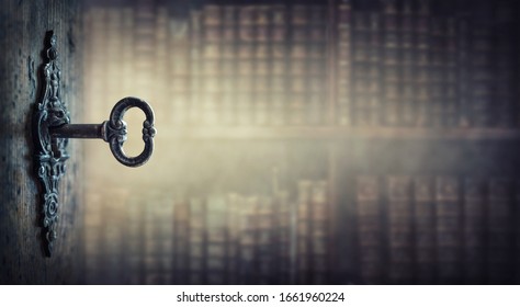 Old key in keyhole, macro shot. Gothic style. Key to knowledge. Concept and Idea for History, education, business, security, secret background.  - Shutterstock ID 1661960224