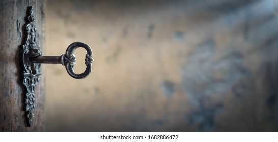 Old Key In Keyhole, Macro Shot. Gothic Style. Key To Knowledge. Concept And Idea For History, Education, Business, Security, Secret Background. 