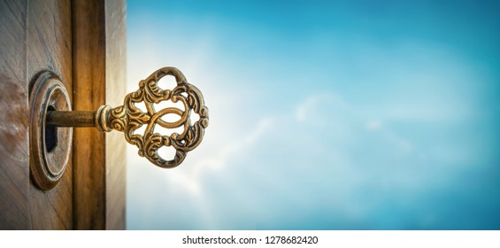 Old key in keyhole sky background and sun ray   Concept  symbol   Idea for History  business  security  religion background 