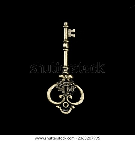 An Old Key on a Black Background