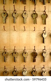 Old Keys Hang On Wood Board