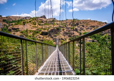 Old Khndzoresk, Armenia - July 7, 2018: Suspension bridge in Khndzoresk old town near Goris, Armenia