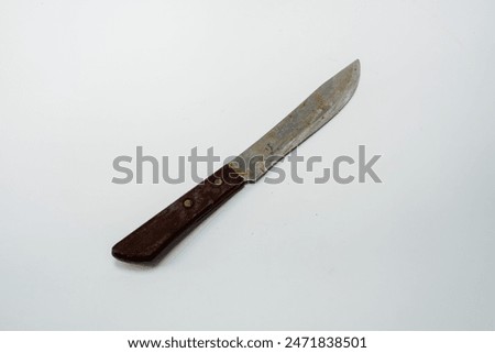 Old kitchen knife, white background with rust marks and use, black plastic handle.