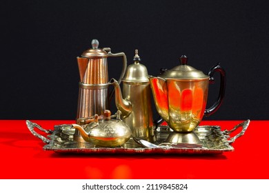 Old kitchen silverware on a bright, colored background 