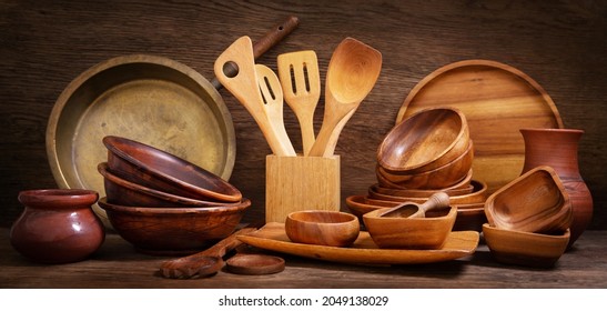 Old kitchen utensils on a wooden background - Shutterstock ID 2049138029