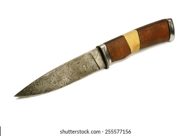 Old knife of Damascus steel - forged metal,traditionally used for creating cold arms on Middle East