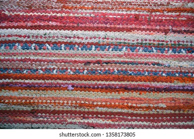 old knitted colorful carpet abstract background and texture
