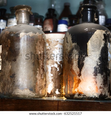 The old lab. The table of the alchemist. Laboratory table, stained with chemicals and poisons.