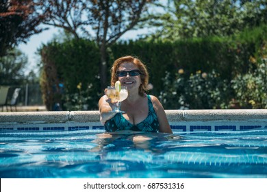 Old Lady With A Cocktail In The Pool