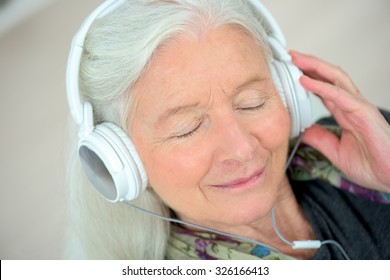 Old lady with headphones on