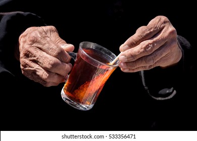 Old Lady Holding Persian Tea