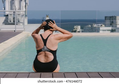 Old Lady On The Pool From The Back