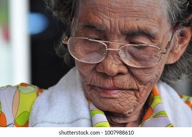 Old Lady Reading Newspaper