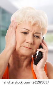 Old Lady Talking Through Phone, Receiving Bad News.