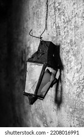 Old Lamp Fallen On Small Street Black And White Photo