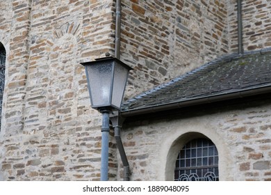 an old lantern is fixed in front of the building
